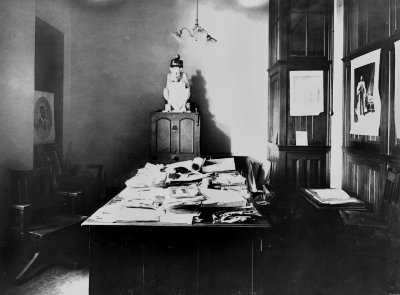 Devil statue on desk.