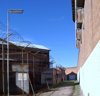 Photo of Track, outer wall, and cellblock at No.2 Division, Boggo Road.